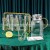 6 Cups With Green Hand + Holder + Kettle With Gold Handle  + $30.00 
